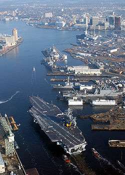 The nuclear-powered aircraft carrier USS Harry S. Truman (CVN-75) transits the Elizabeth River at Norfolk Naval Shipyard.