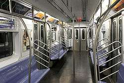The empty interior of a newer R142A car on the 4 train