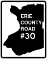 A white rectangle with the outline of Erie County in black at its center. The text Erie County Road #30 is inside the outline in white.
