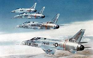 Four jet aircraft flying in formation, with the furthest to camera at top left, and the closest at bottom right