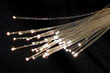 A bunch of pale yellow semi-transparent thin strands, with bright points of white light at their tips.