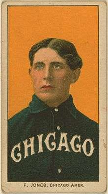 Baseball card showing medium shot of white man with brown hair parted in the center wearing a baseball shirt with "Chicago" written across it