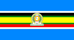 Nine horizontal strips coloured (from top to bottom): blue, white, black, green, yellow, green, red, white, then blue. The logo of the EAC is placed in the centre.