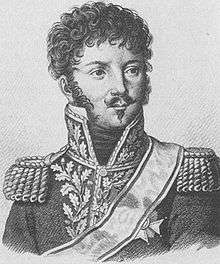 Black and white print of a curly-haired man with a moustache and Van Dyke beard. He wears a dark Napoleonic era general's uniform with epaulettes and a high collar with gold lace.
