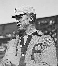 Black and white image of Grover Cleveland Alexander standing ready with a baseball bat in his Phillies uniform