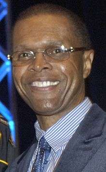 Gale Sayers giving a speech in 2008