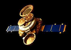 An image of a spacecraft, with two solar panels on either end, and a collection system in the open position, visible on the top of the spacecraft, with the lid open.
