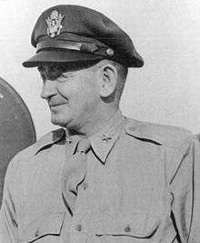 Head and shoulders view of smiling middle aged man wearing air force "crush cap".