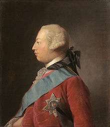 Quarter-length portrait in oils of a clean-shaven young George in profile wearing a red suit, the Garter star, a blue sash, and a powdered wig. He has a receding chin and his forehead slopes away from the bridge of his nose making his head look round in shape.