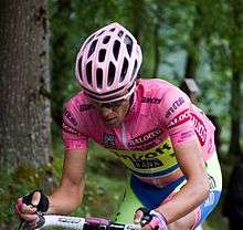 Alberto Contador riding uphill while wearing the pink jersey