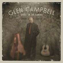 The album cover features Campbell wearing a long black coat standing with an open guitar-case to his right and an acoustic guitar to his right. Above him are the words "GLEN CAMPBELL / GHOST ON THE CANVAS" written in white.