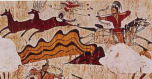 Mural of men on horses with bows and arrows shooting deer.