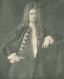 A three quarter length black and white engraved portrait of William Dummer. He is wearing fashionable early 18th century clothing and a long wig.