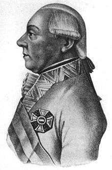 Black and white print of a man in a white military uniform with the Maria Theresa Order cross displayed. He wears a late 18th century wig