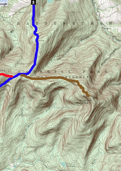 A topographic map of Graham Mountain with a green background and brown contour lines. A blue line descends from an icon with a hiker on it near the top left to the center left, where a brown line extends to the mountain's summit