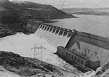Grand Coulee Dam with water coming over central spillway
