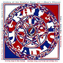 A complex interlaced image of blue, red, and white centered around the Grateful Dead "Steal Your Face" skull logo