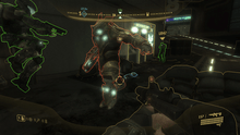 Two armored humans confront a large, bulky alien. Characters and terrain objects in the urban setting are outlined in yellow, red, or green. In the corners of the screen are head-up display information detailing location, health, and ammo.