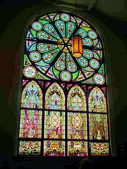 Large stained glass window with rose window