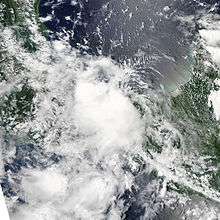 Satellite image of a disorganized tropical cyclone. Banding features are not very distinguishable.