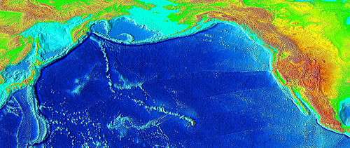 Raised-relief map of the Pacific basin, showing seamounts and islands trailing the Hawaii hotspot in a long line terminating near the Russian island of Kamchatka Peninsula in Russia.