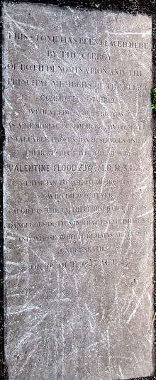 A large limestone grave slab with carved inscription