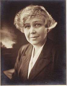 Head and shoulders portrait of a woman with short hair