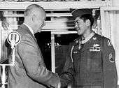 Hiroshi H. Miyamura shaking hands with President Eisenhower after being presented with the Medal of Honor