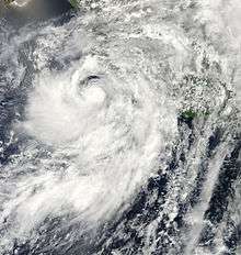 A visible satellite image of a disorganized and large hurricane just offshore southwestern Mexico on July 6.