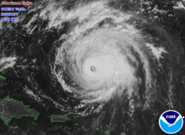 A view of Hurricane Erika from Space on September 8, 1997. The storm's eye, visible near the center of the image, is well-defined and representative of a strong hurricane. Puerto Rico and the Dominican Republic are seen to the southwest of Erika.