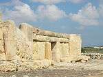 Façade of a prehistoric temple made up of large megaliths.