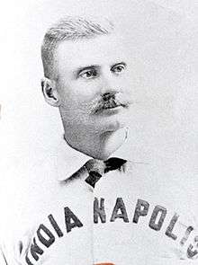 A baseball player is shown in his uniform, from chest up.