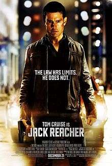The poster shows a man, injured and holding a gun, standing in front of a car. Text at the bottom reveals the tagline and in bottom reveals the film's main actor and title, credits, rating and release date.