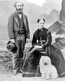 An image showing Katherine Clerk Maxwell (seated), with her husband James Clerk Maxwell and the couple's terrier.