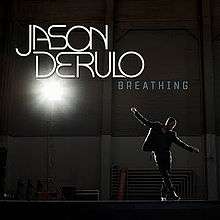 Derulo standing in a warehouse with his arms out wide, as a bright light on the left side of the cover shines down on him. Above him are the words "Jason Derulo" and "Breathing".