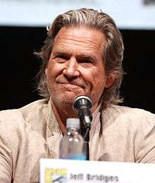 Jeff Bridges in front of a microphone during a press conference.