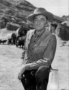 Portrait of an elderly man in cowboy garb.
