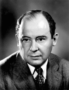 Formal photo of a balding man wearing a suit
