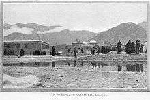 Early photograph of Jokhang behind a small body of water