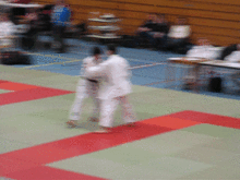 Demonstration of a seoi nage judo throw.