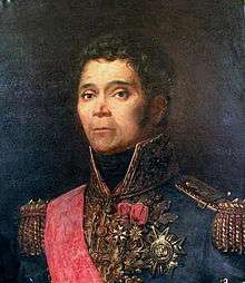 Painted portrait of Kellermann while wearing his French blue general uniform with yellow epaulettes, a red sash, and high collar. His hair and eyes are brown and he gazes to the left of the viewer. Kellermann wears three decorations on his chest.