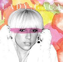 Lady Gaga's face, in black and white, against a colorful background of pink, yellow, red and green shapes. She wears a white jacket and white gloves and holds her hands in fists near her ears. A translucent pink streak covers the woman's eyes and part of her hair. At the top of the image, "Lady Gaga" is written in all capital white letters, with a white line separating the two words. Below this, "The Cherrytree Sessions" is written in all lowercase orange letters.