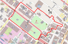 A map of the district showing its boundaries in red, parkland in green, buildings in gray and major roadways in dark pink