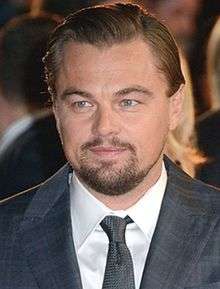 Leonardo DiCaprio smiling at the camera.
