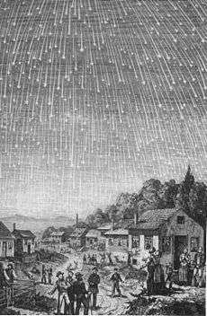 A sky full of shooting stars over a village