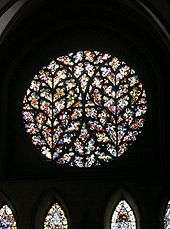 A very elaborate rose window with tracery forming a pattern like two ears of wheat.