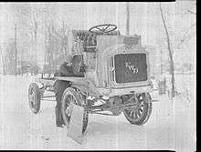 Luella Bates doing mainetance on a FWD Model B truck.