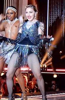 Madonna in a flapper dress dancing on stage