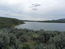 A photo of Magic Reservoir on a cloudy June day