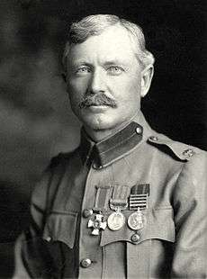 Burnham portrait photograph taken in 1901. He is dressed in his British Army uniform, with major insignia, Distinguished Service Order Cross, British South Africa Medal, and Queens South Africa Medal.